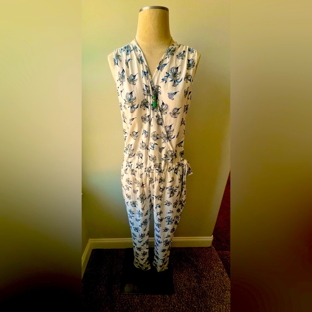 Brand New floral jumpsuit with elastic waist band comes in various sizes.